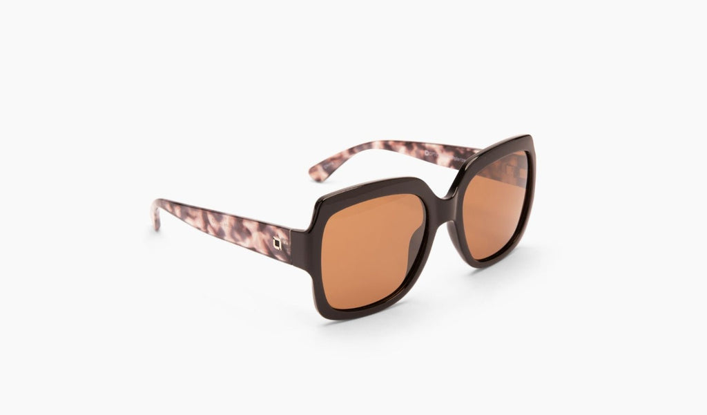 Optic Nerve Asana sunglasses with a black frame and brown lenses on a white background