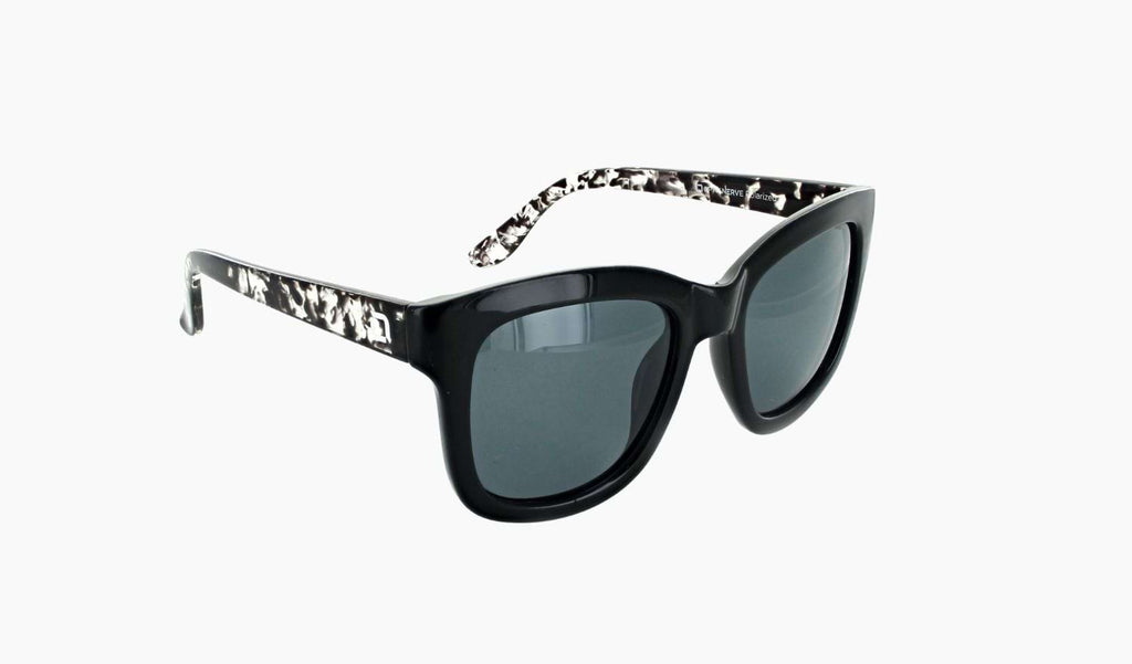 Optic Nerve Baby Doe sunglasses with black frame and smoke lenses on a white background