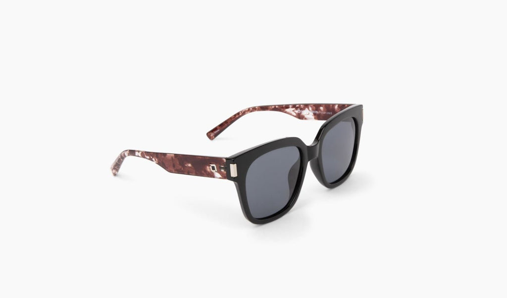 Optic Nerve Gracie sunglasses with a black frame and smoke lenses on a white background