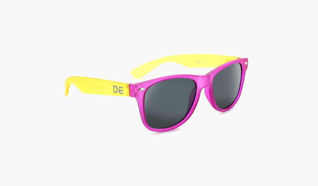 Optic Nerve Kids Boogie sunglasses with yellow temples, purple frame and smoke lenses on a white background